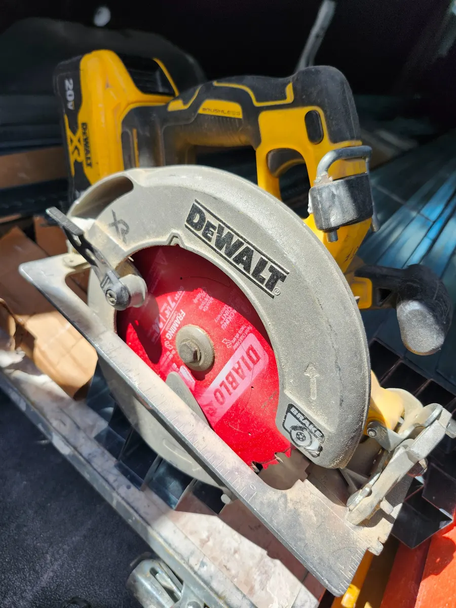 My field-used DEWALT DCS391B 20V MAX cordless circular saw with a red framing blade.