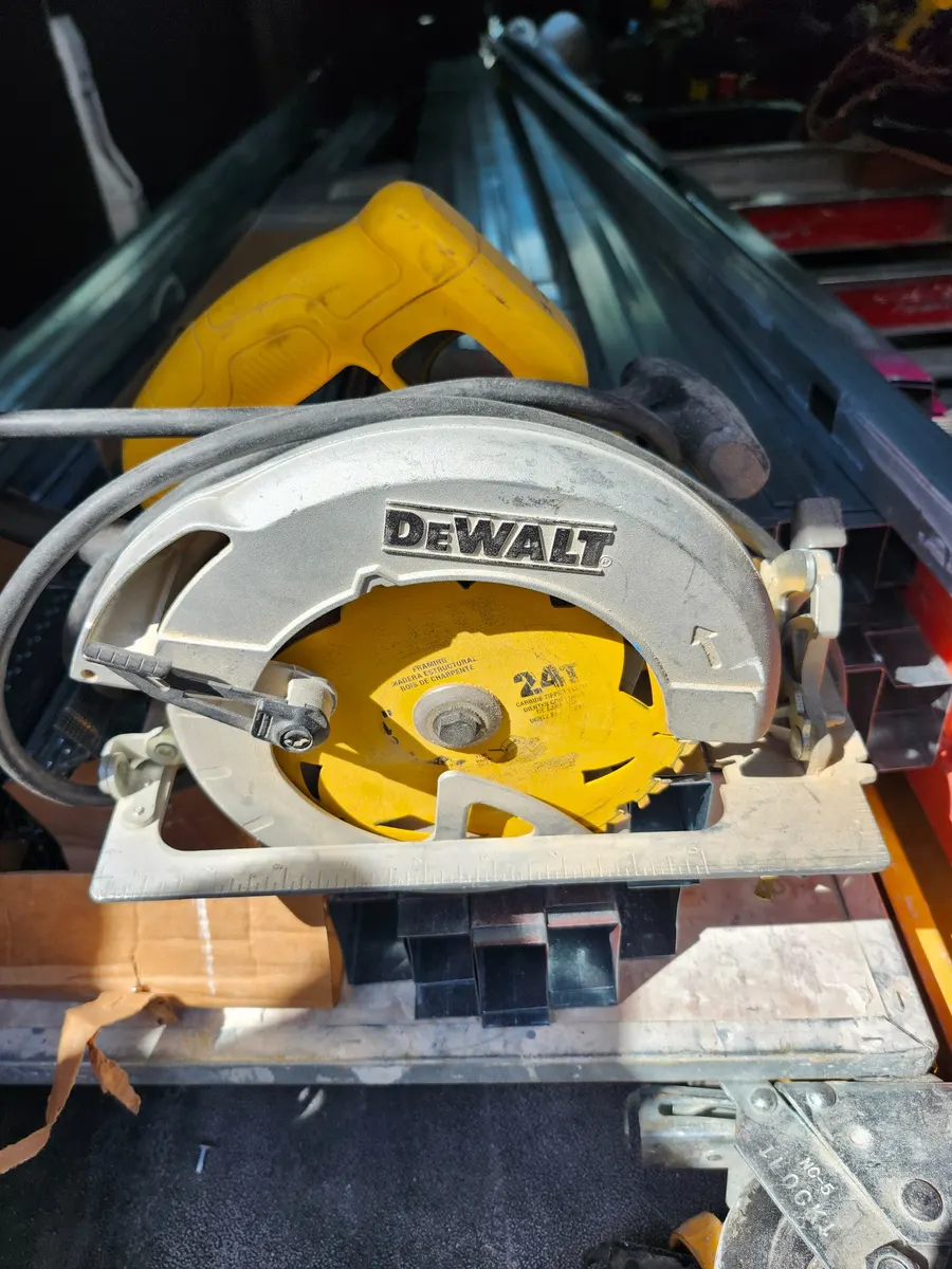 My field-used DEWALT DWE575 7-1/4-inch corded circular saw stored with framing material.