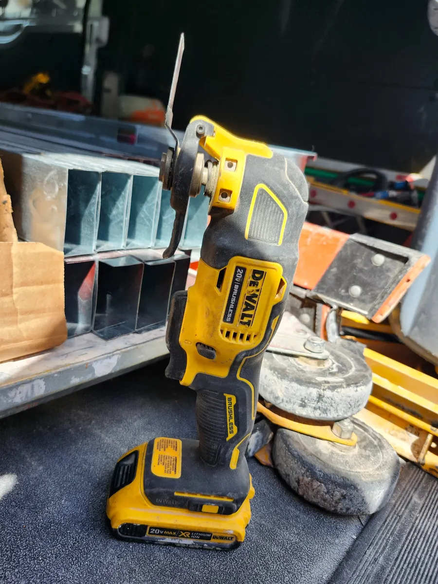 My field-used DEWALT DCS354B ATOMIC oscillating multi-tool with a blade installed.