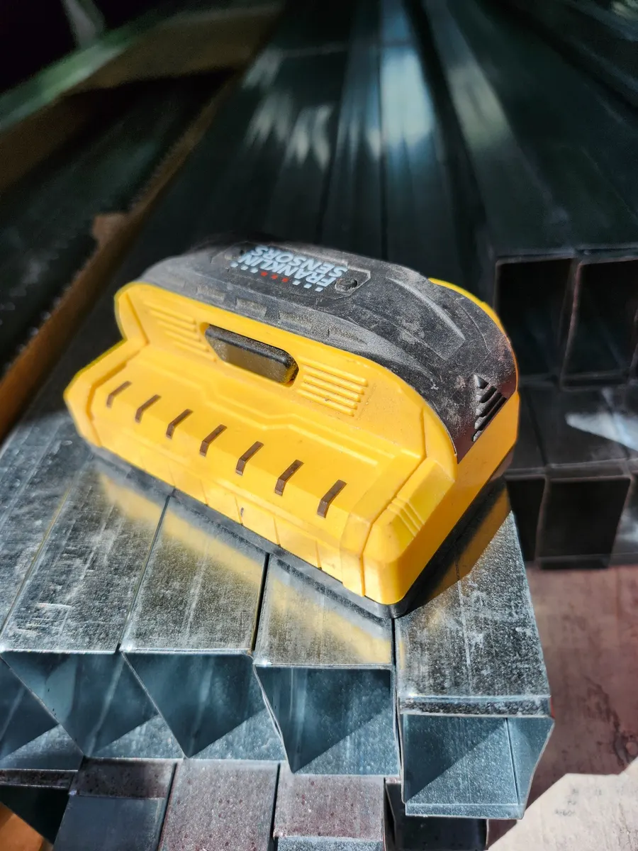 My field-used Franklin Sensors ProSensor stud finder resting on metal framing material.