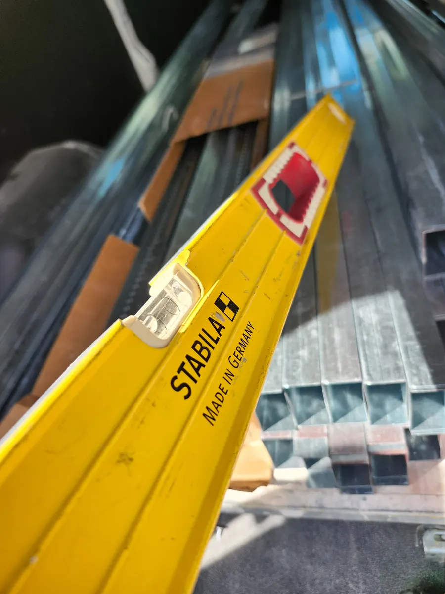 My field-used STABILA 48-inch magnetic level photographed with metal framing material.